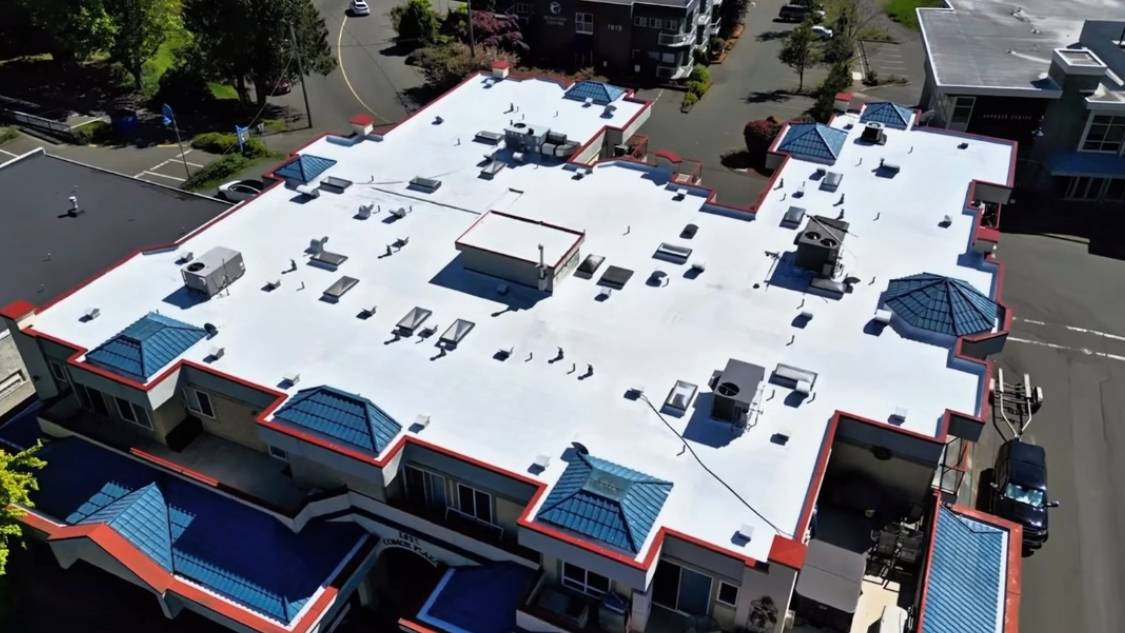 A building with white roof and blue sky