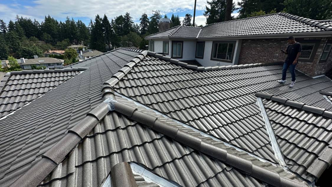 A roof with some metal tiles on it