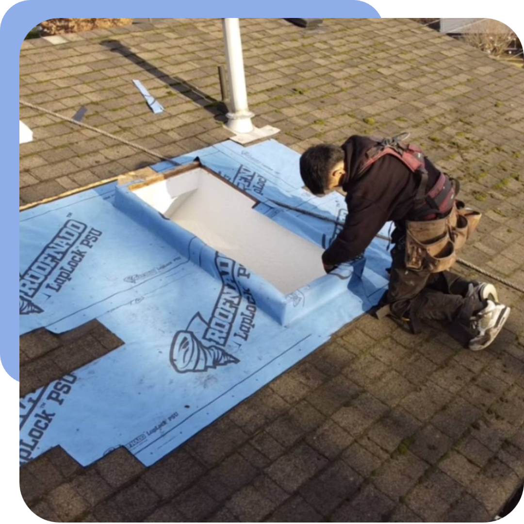 New Project (26) A man working on the roof of a house.
