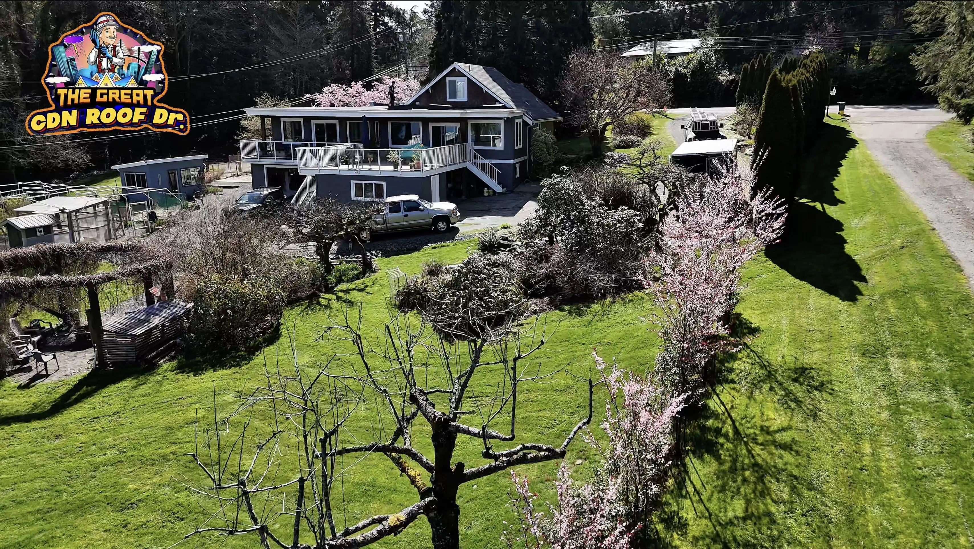 A house with trees in the background and cars parked on the side of it.